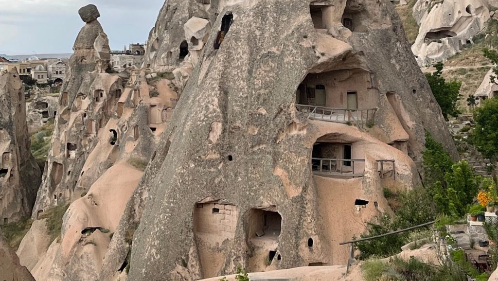 Historic rock castle and carved ancient cave dwellings in Uchisar Cappadocia Turkey